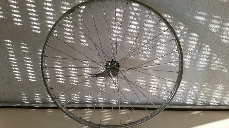 Rear wheel / 635X22C / Van Schothorst / ST32 RVS / Silver / Shimano / CB-E110 / 1S / 100 MM / Coaster brake / City