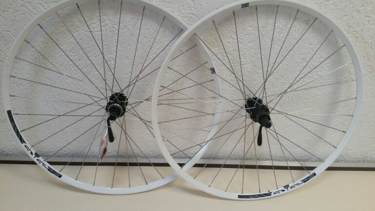 Wheelset / 584X21C / Rigida - Ryde / Edge 7 / White / Shimano / FH-RM66 & HB-RM65 / HG Body 35 MM  / 135 MM / Disc (Centerlock) / MTB - Tour