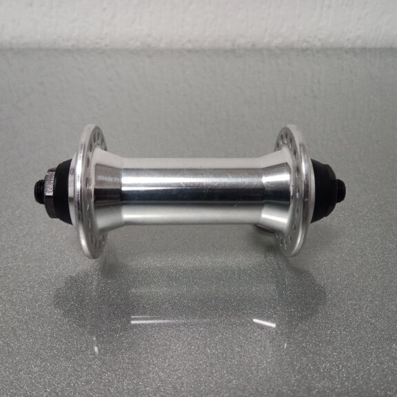 Front hub / 100 MM / Drop axle / Rim brake / 36GTS / Sunrace / UNI / Silver / Race 